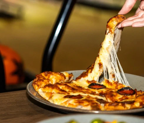 Pizza Pull Showcasing Food Available at Woking Superbowl